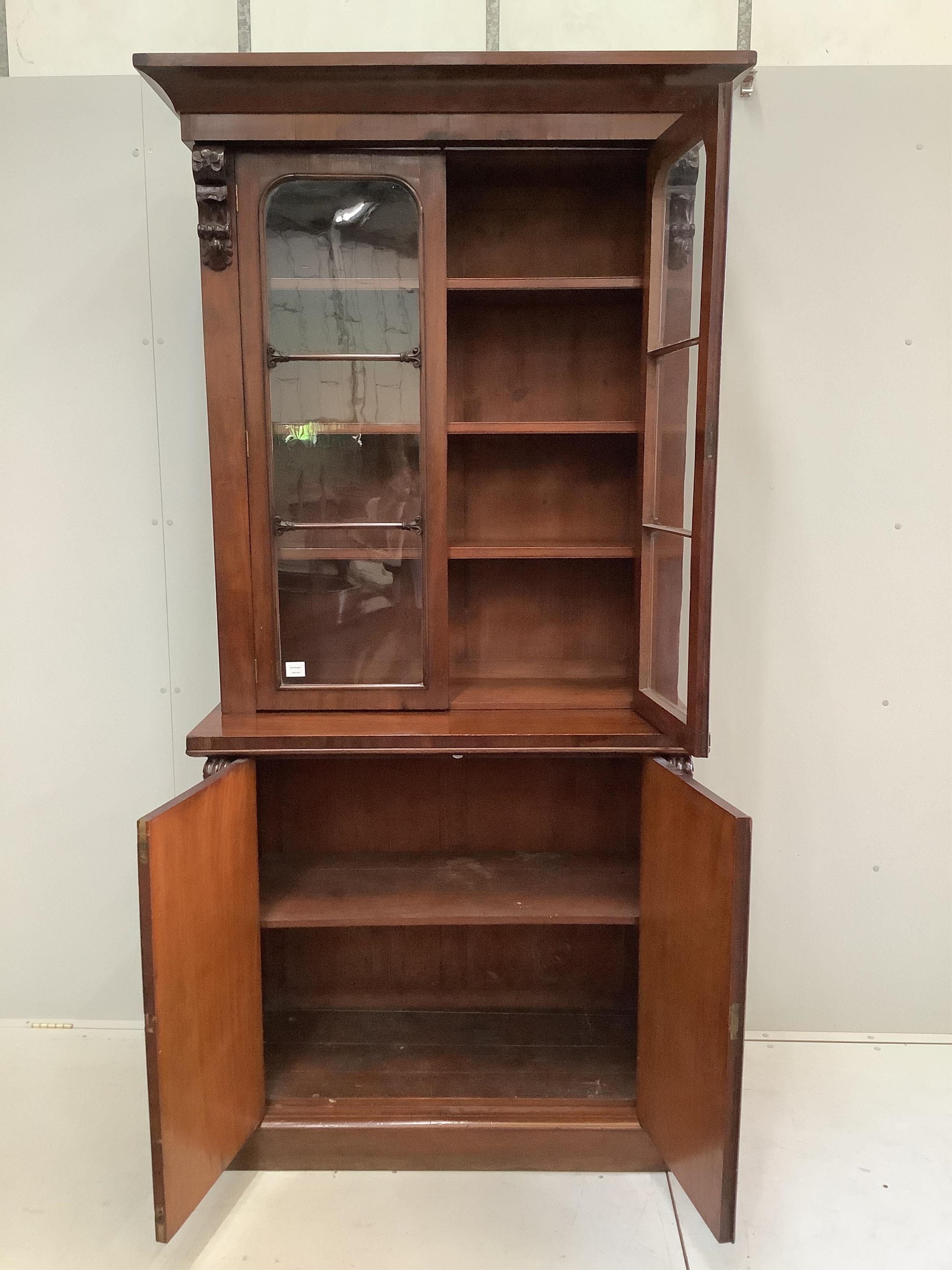 A Victorian mahogany chiffonier bookcase, width 105cm, depth 50cm, height 224cm. Condition - fair